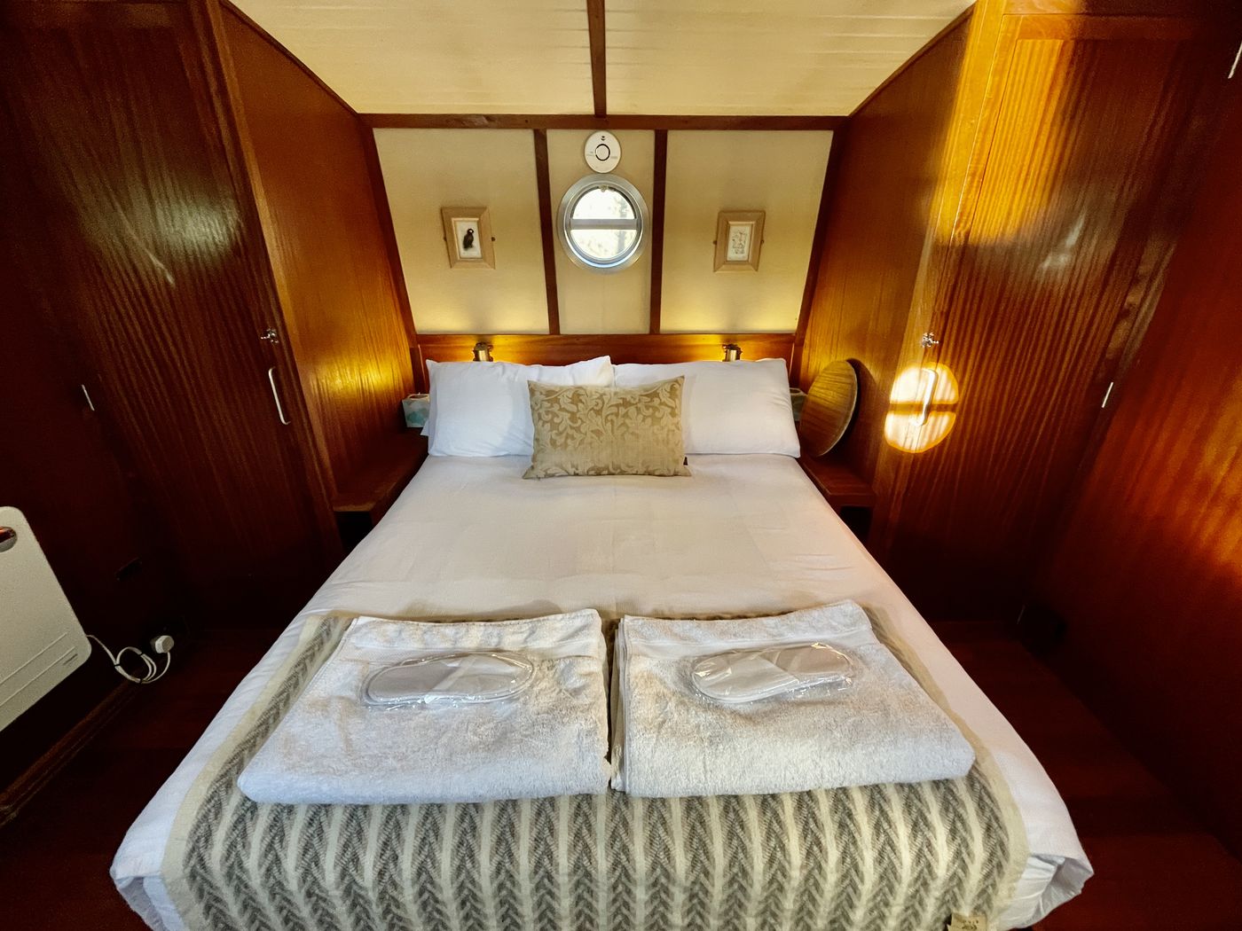 Cabin with double bed and wood panelling